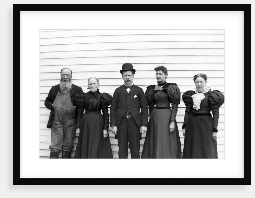 The family poses in their Sunday best, ca. 1900. by Anonymous
