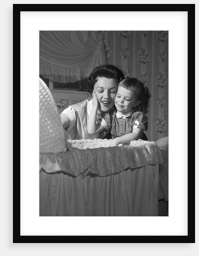 1950s mother & daughter admiring baby in bassinet by Anonymous