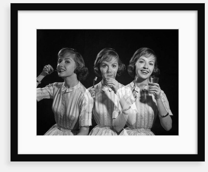 1950s 1960s multiple exposure woman brushing teeth by Anonymous