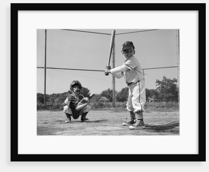 1960s two boys playing baseball batter and catcher at home plate by Anonymous