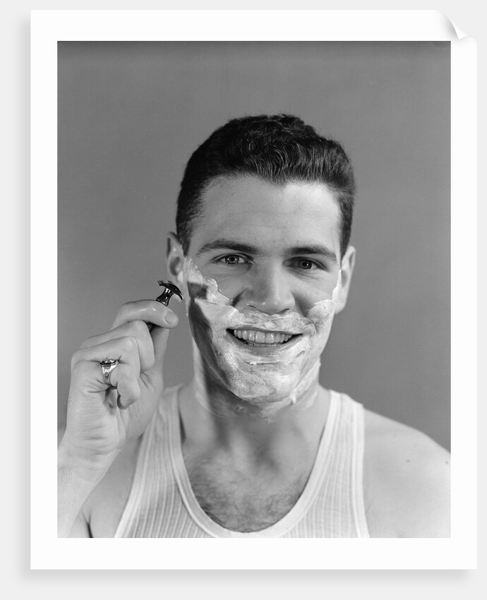 1940s smiling man shaving wearing tee shirt by Anonymous