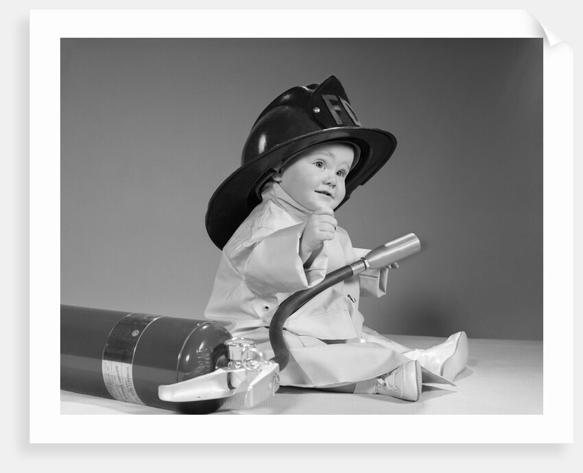 1960s baby fireman with safety hat coat and fire extinguisher by Anonymous