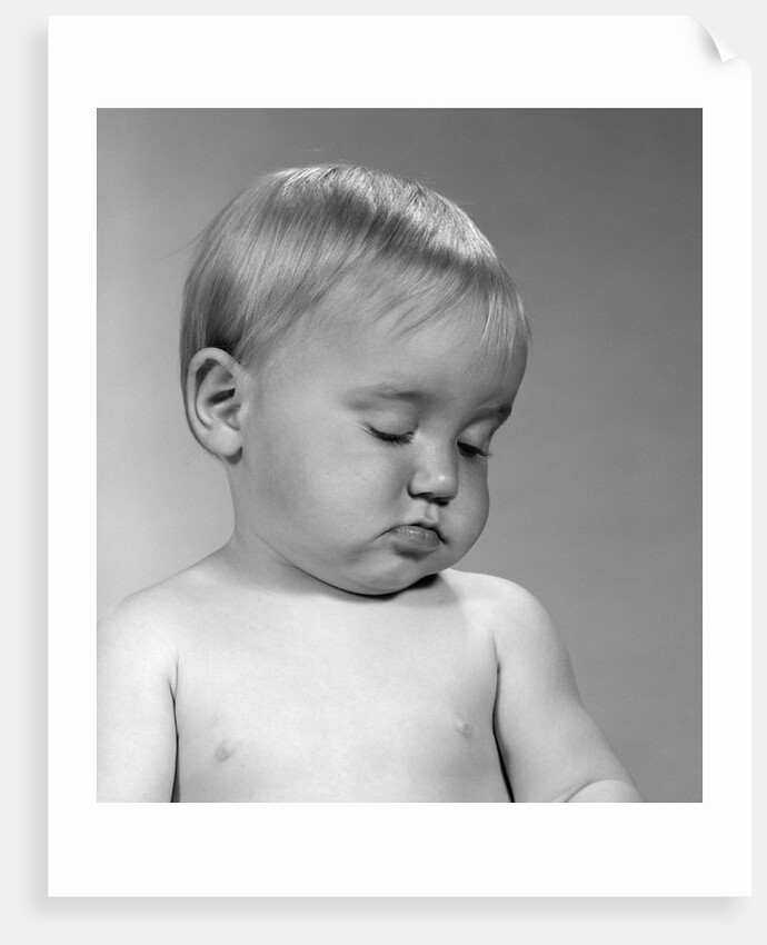 1960s portrait baby nodding off to sleep by Anonymous