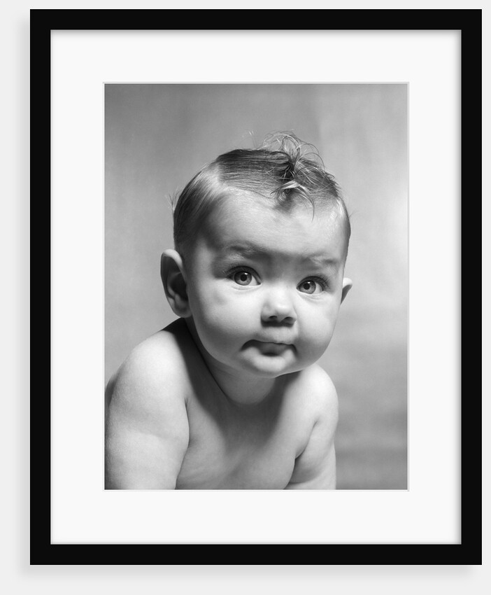 1950s cute smirking baby looking at camera by Anonymous