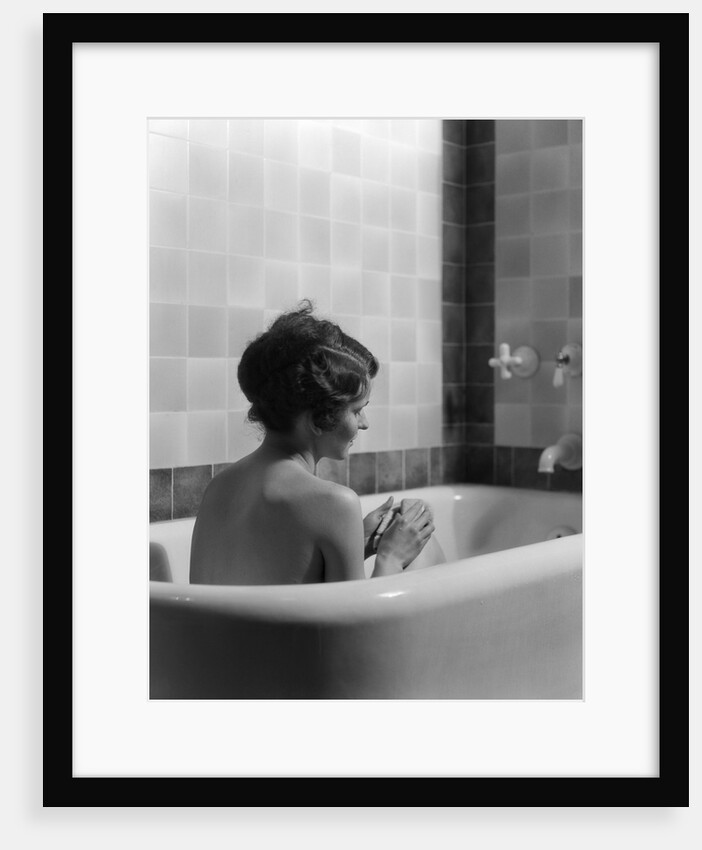 1920s 1930s woman sitting in bath tub by Anonymous