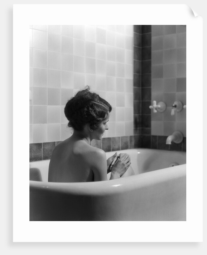 1920s 1930s woman sitting in bath tub by Anonymous
