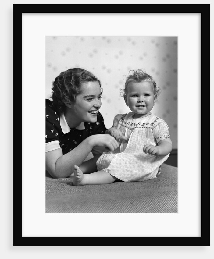 1930s smiling mother and happy child looking at camera by Anonymous