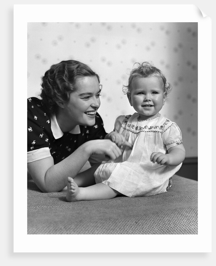1930s smiling mother and happy child looking at camera by Anonymous