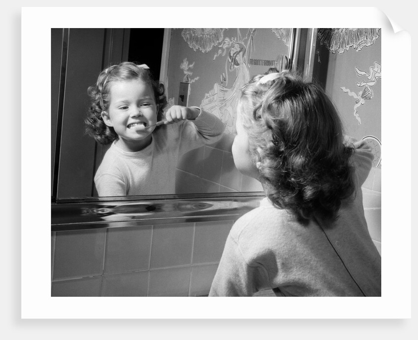 1950s girl looking in bathroom mirror brushing teeth by Anonymous