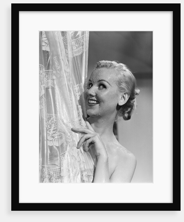 1950s portrait of wet blonde peeking around shower curtain by Anonymous