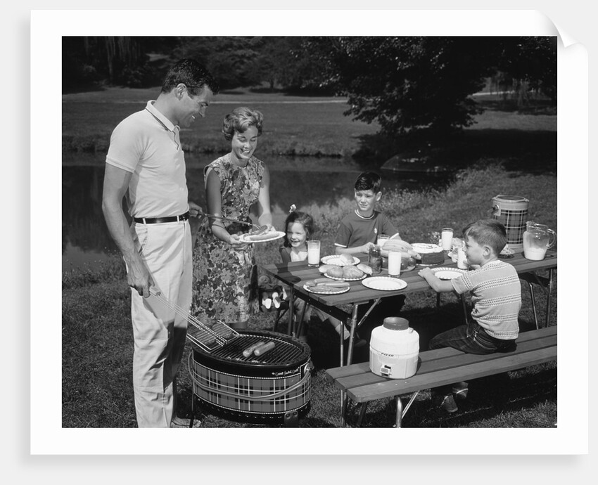 1950s family picnic bar-b-cue mom dad children by Anonymous