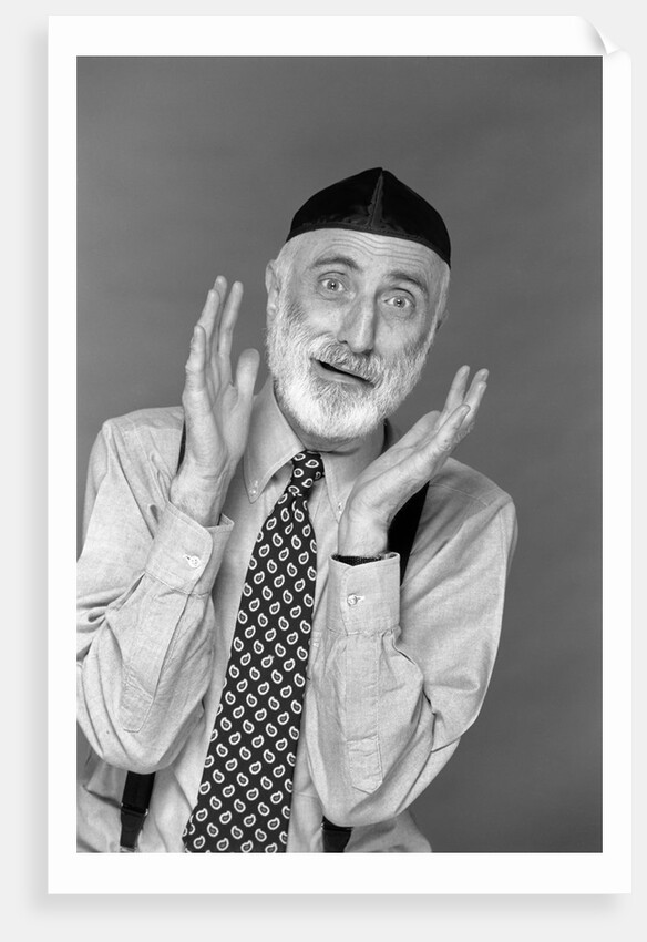 1990s character portrait man gray beard wearing yarmulke hebrew jewish skullcap hands up to face gesture funny expression oy looking at camera by Anonymous