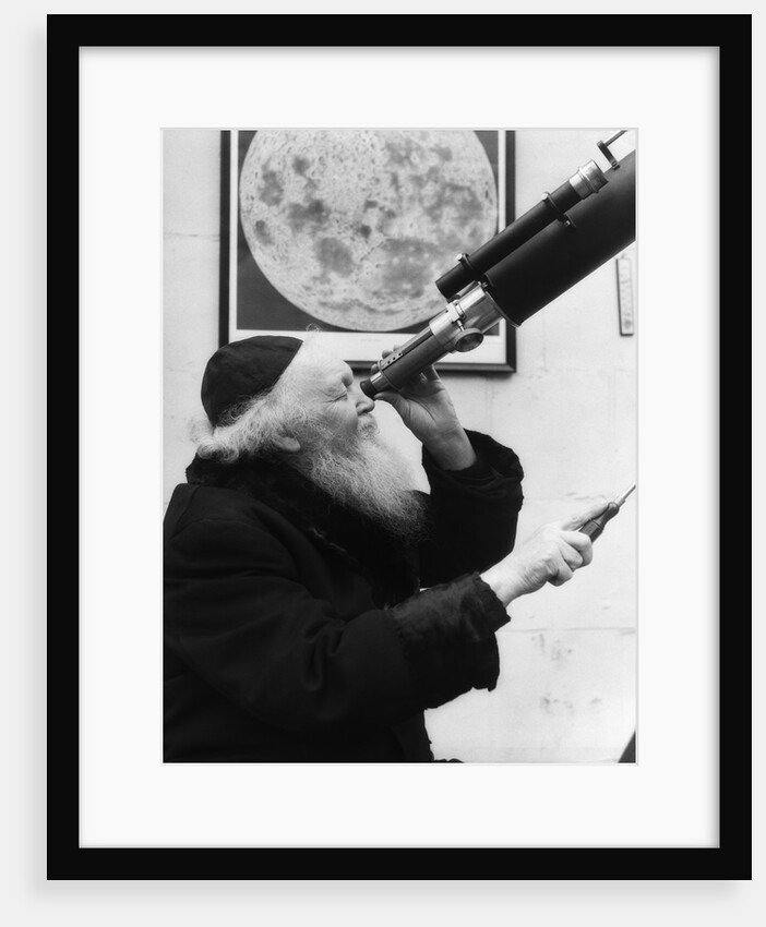 1930s old astronomer white hair and beard wearing skull cap looking through telescope by Anonymous
