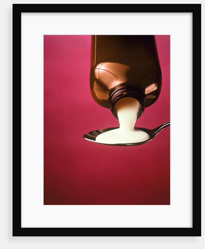 1980s spoonful of white medicine from bottle by Anonymous