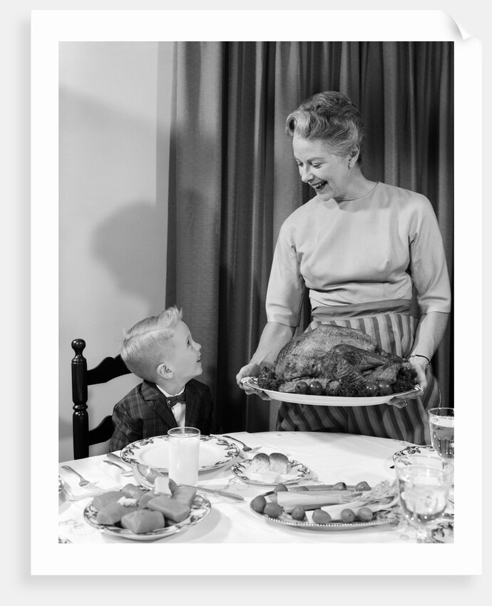 1960s grandmother grandson roast turkey thanksgiving dinner by Anonymous