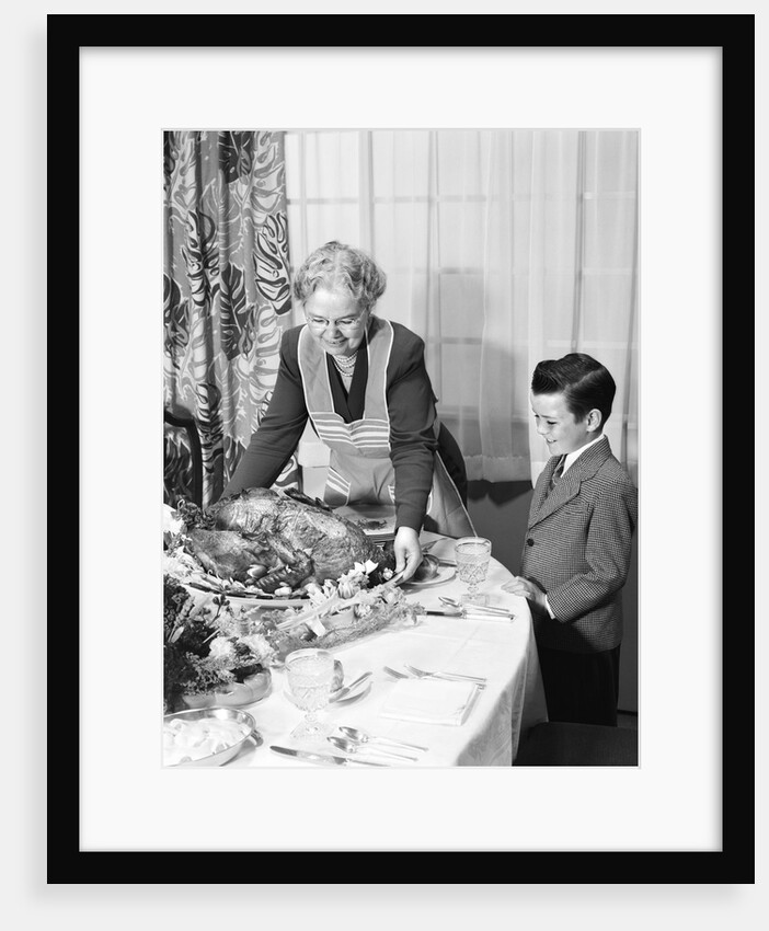 1950s grandmother grandson turkey thanksgiving dinner by Anonymous