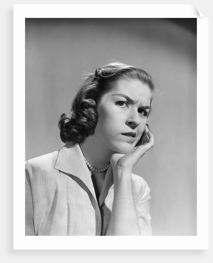 1950s 1960s woman portrait worried facial expression hand to cheek tooth pain by Anonymous