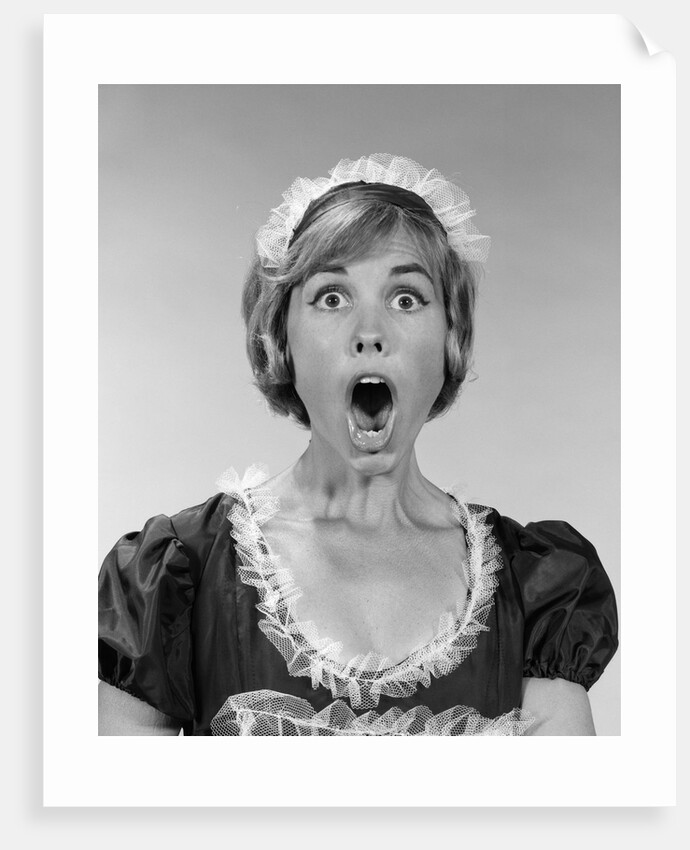 1960s woman in maid uniform eyes and mouth wide open looking at camera by Anonymous