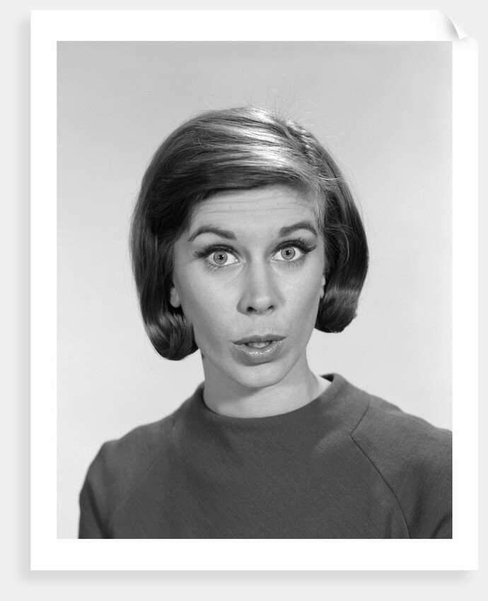 1960s woman portrait looking at camera asking question wonder puzzled funny face expression by Anonymous