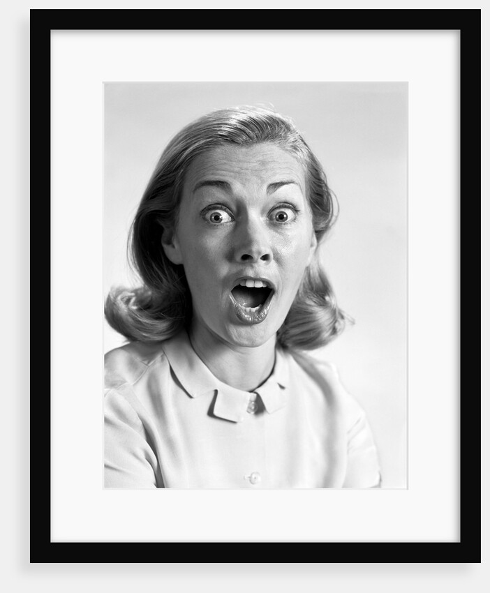 1960s head shot woman eyes and mouth wide open terrified expression looking at camera by Anonymous