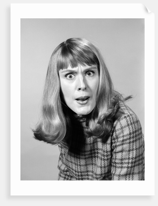 1960s head shot angry woman looking at camera by Anonymous