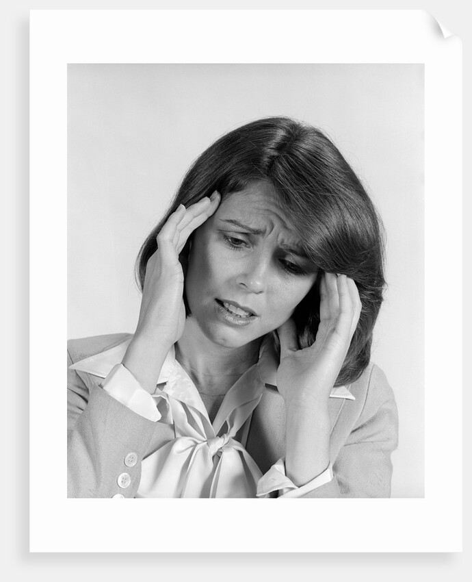 1980s portrait woman hands massaging temple forehead headache distress stress by Anonymous