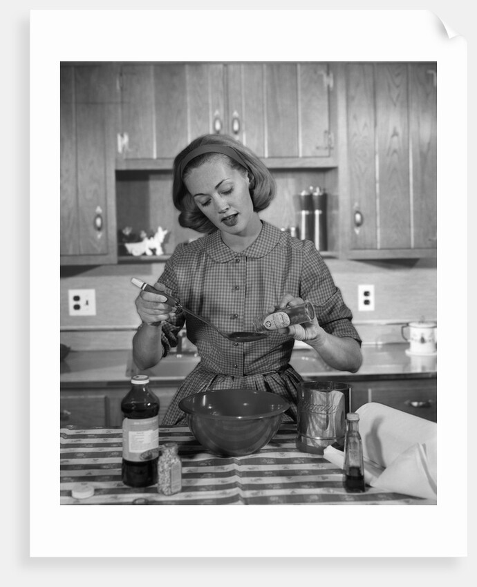 1960s woman baking in kitchen by Anonymous