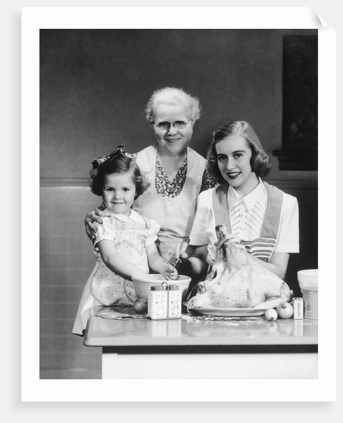 1940s 1950s mother daughter grandmother stuffing turkey by Anonymous