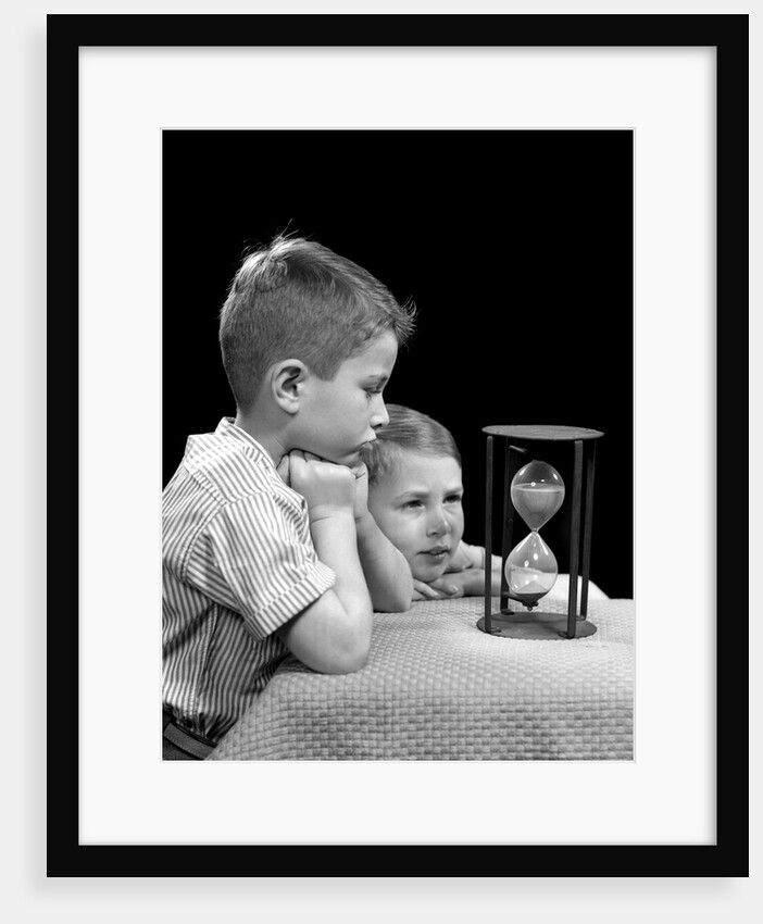 1940s two boys waiting watching sand falling in hourglass by Anonymous