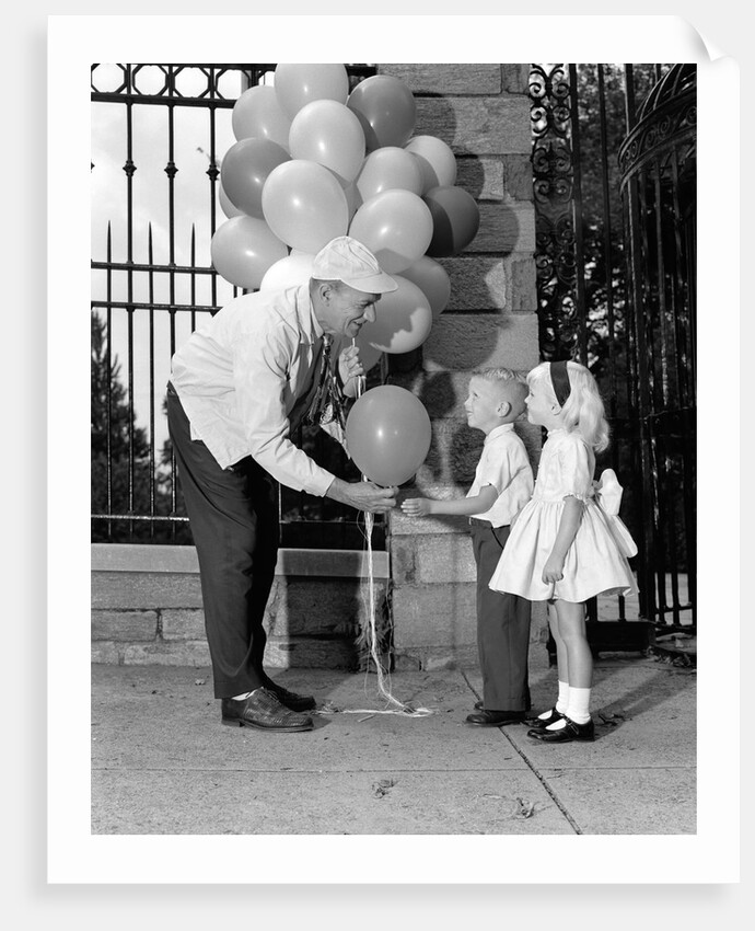 1960s children boy girl getting a balloon from man by Anonymous