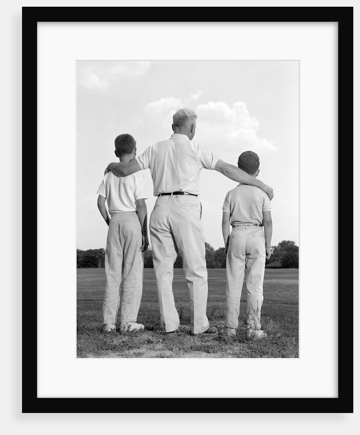 1960s back view grandfather with two grandsons boys by Anonymous