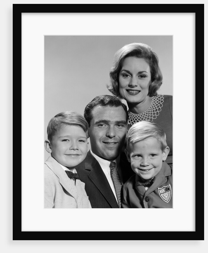 1960s family portrait father mother two sons smiling by Anonymous