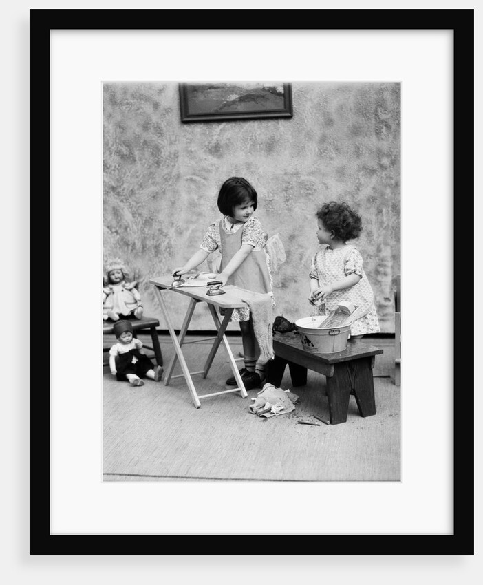 1920s two little girls playing ironing washing doll clothes by Anonymous