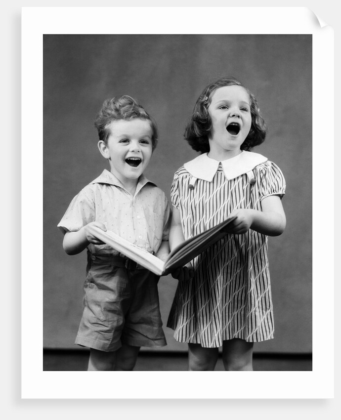 1930s two children standing singing by Anonymous