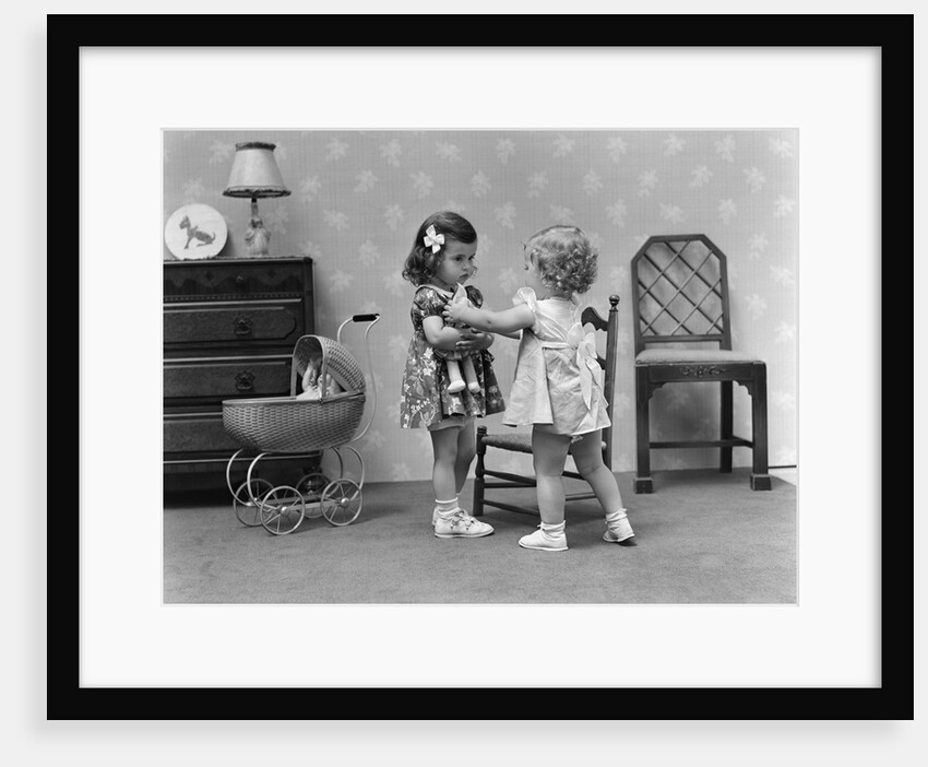 1940s two girls playing with dolls by Anonymous