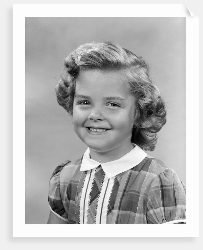 1950s portrait smiling girl with white collar plaid dress looking at camera by Anonymous