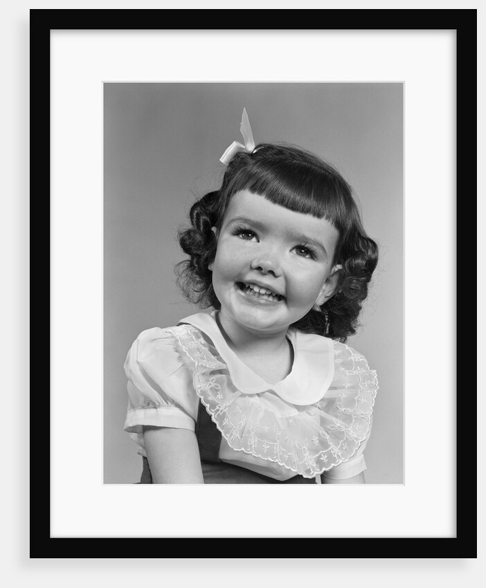 1950s smiling brunette girl with bangs by Anonymous