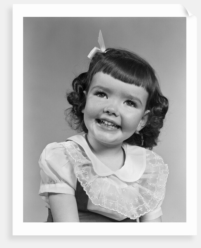 1950s smiling brunette girl with bangs by Anonymous