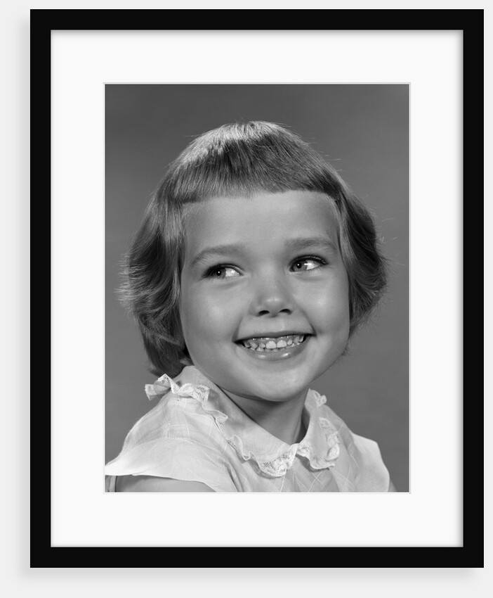 1960s smiling girl looking off to the side by Anonymous