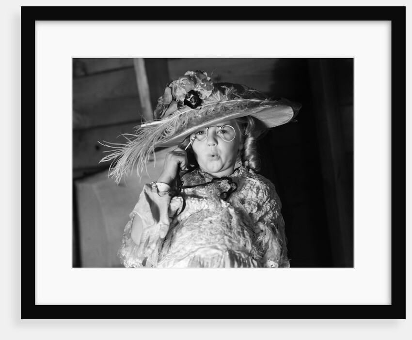 1950s girl play dress up in her mothers clothes hat glasses spectacles facial expression role playing age aging by Anonymous