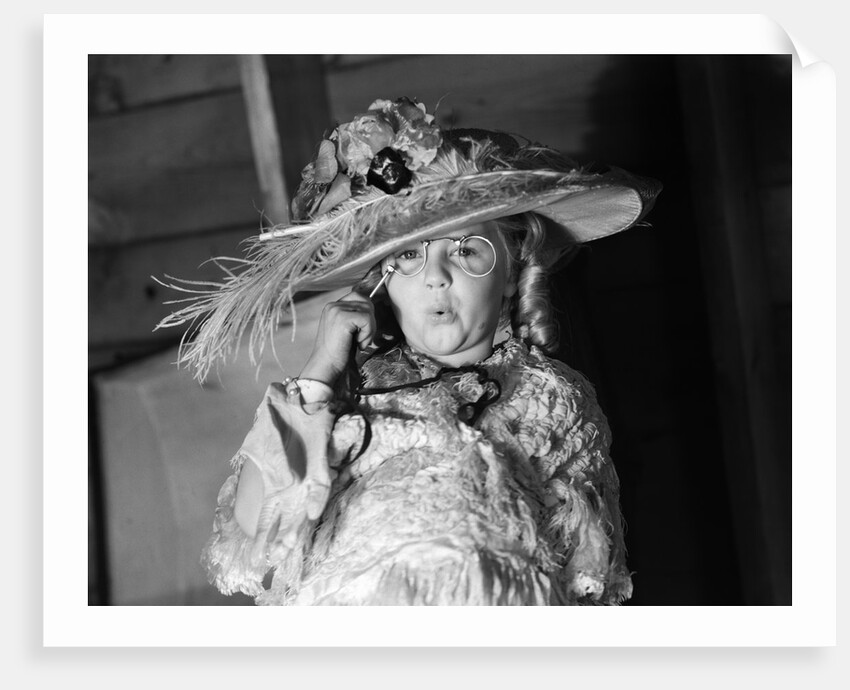 1950s girl play dress up in her mothers clothes hat glasses spectacles facial expression role playing age aging by Anonymous