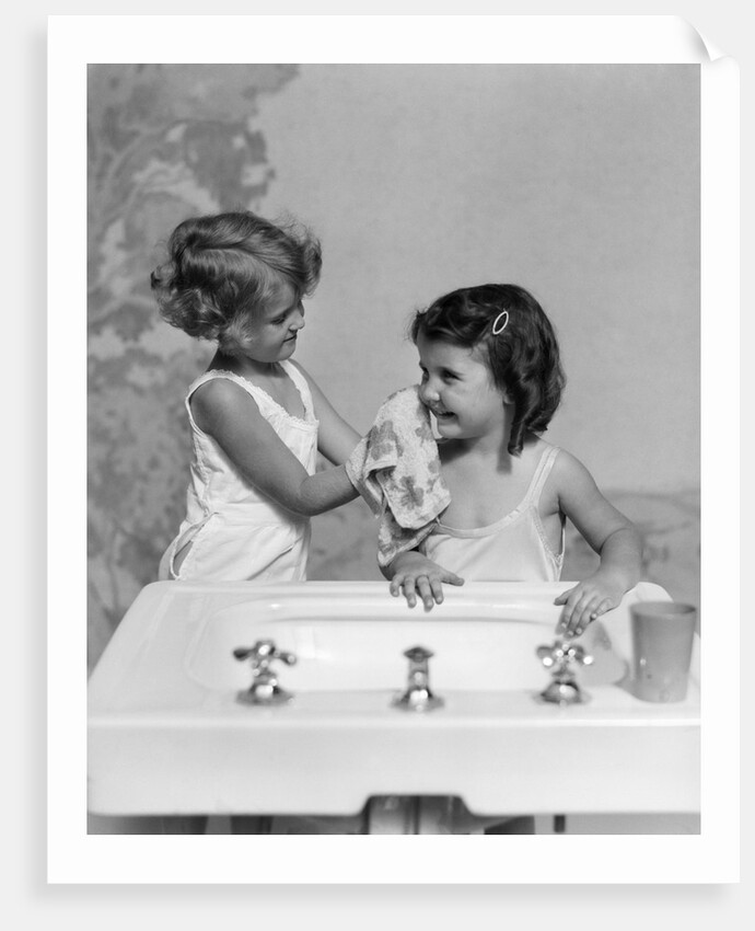 1930s two girls sisters at bathroom sink by Anonymous