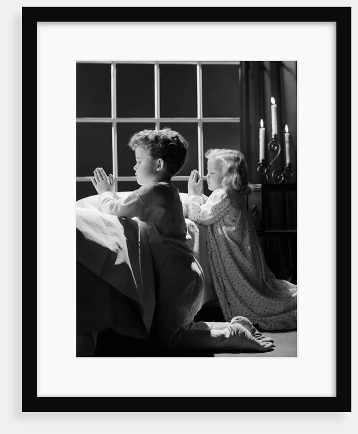 1950s two children praying kneeling night by Anonymous