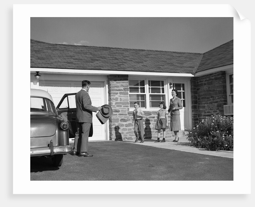 1950s family greeting father in driveway by Anonymous