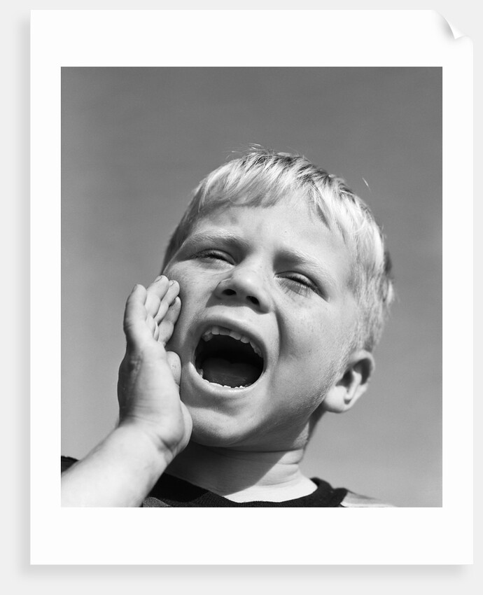 1950s blond boy with eyes closed and hand cupping a wide open mouth shouting by Anonymous