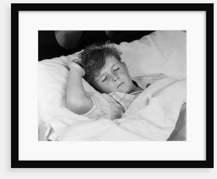 1940s 1950s boy sleeping in bed by Anonymous