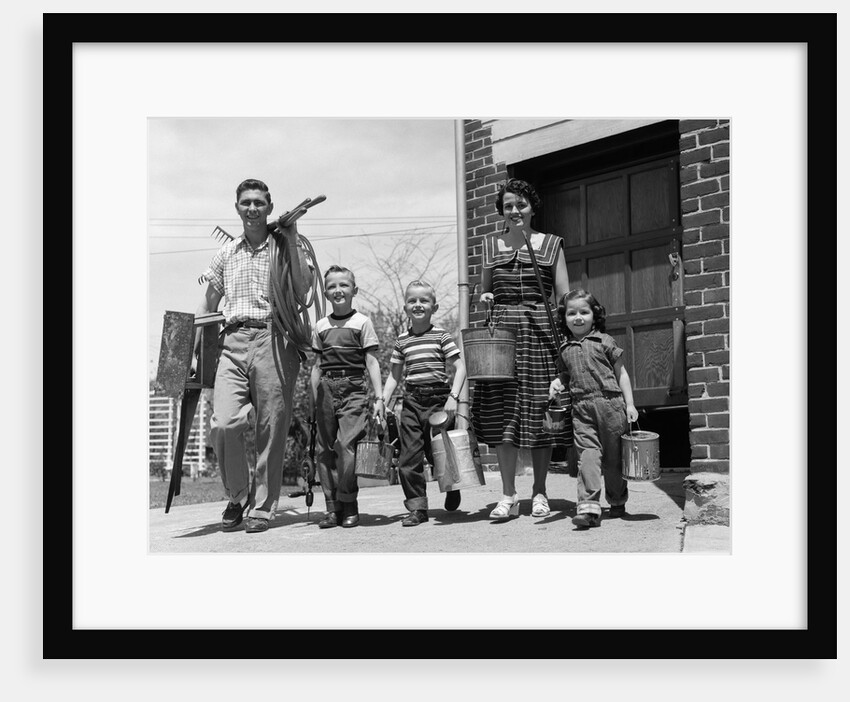 1950s family mother father 3 children happy smiling carrying gardening home improvement tools by Anonymous