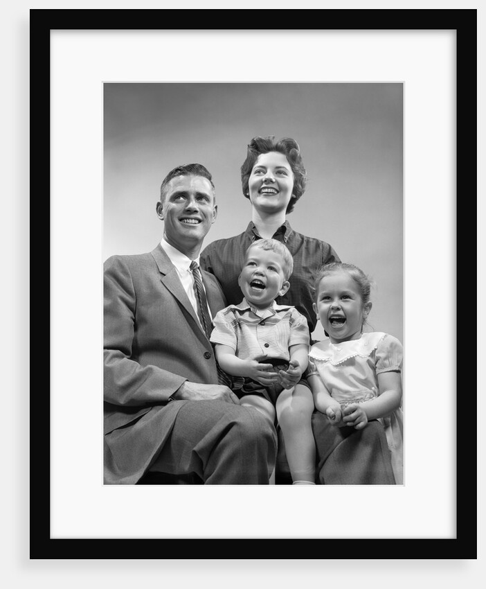 1950s family smiling posing together by Anonymous