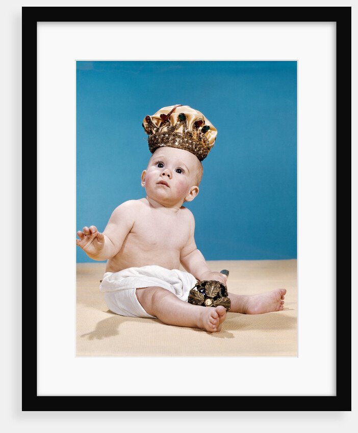 1960s baby wearing cloth diaper and crown holding a scepter by Anonymous