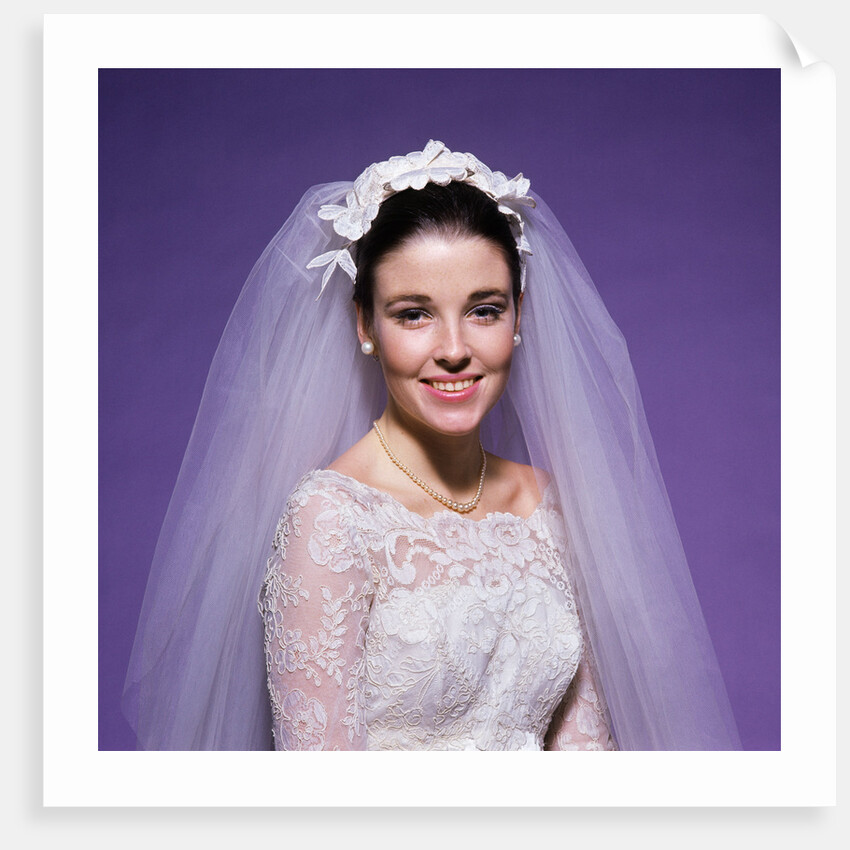 1960s young woman bride portrait bridal veil head shoulders smiling pearls by Anonymous